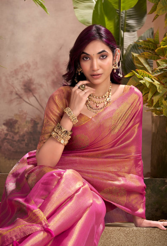 Close view of dark pink tissue silk saree showcasing zari weaving butta and elegant border detailing
