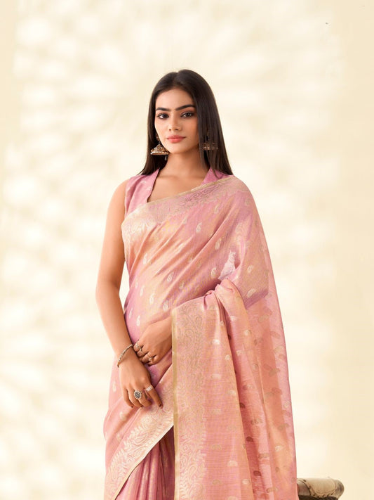 Close view of baby pink tissue linen silk saree showcasing zari weaving butti and elegant pallu detailing