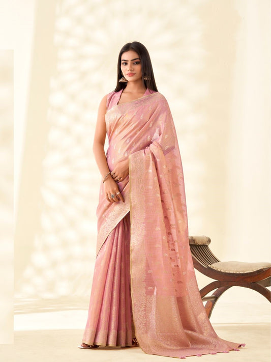 Woman wearing baby pink tissue linen silk saree with zari weaving butti and rich pallu full front view