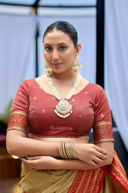 Closeup look of beige Banarasi silk saree blouse with zari weaving work