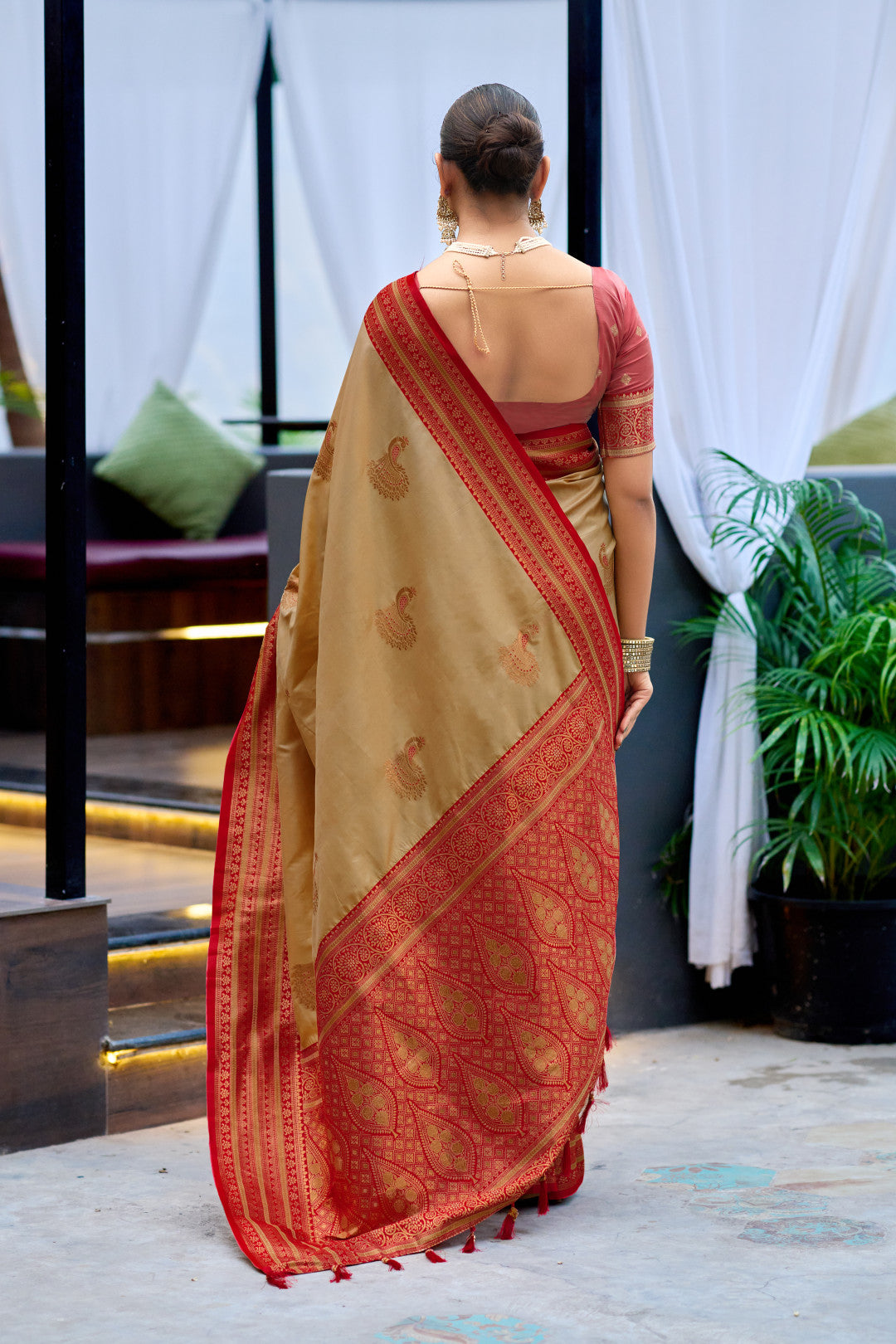 Back view of beige Banarasi silk saree showing zari woven pallu design