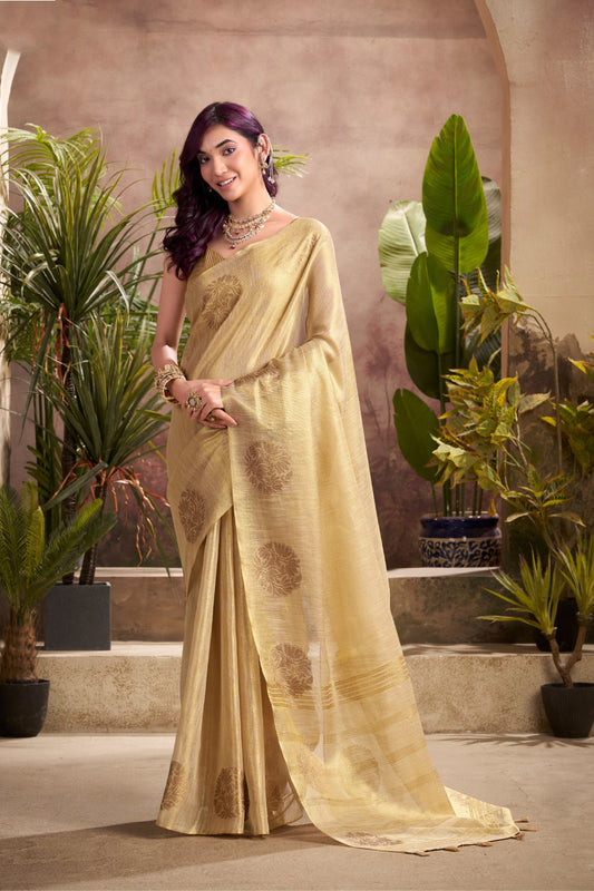 Woman wearing beige tissue silk saree with zari weaving butta and zari border pallu full front view