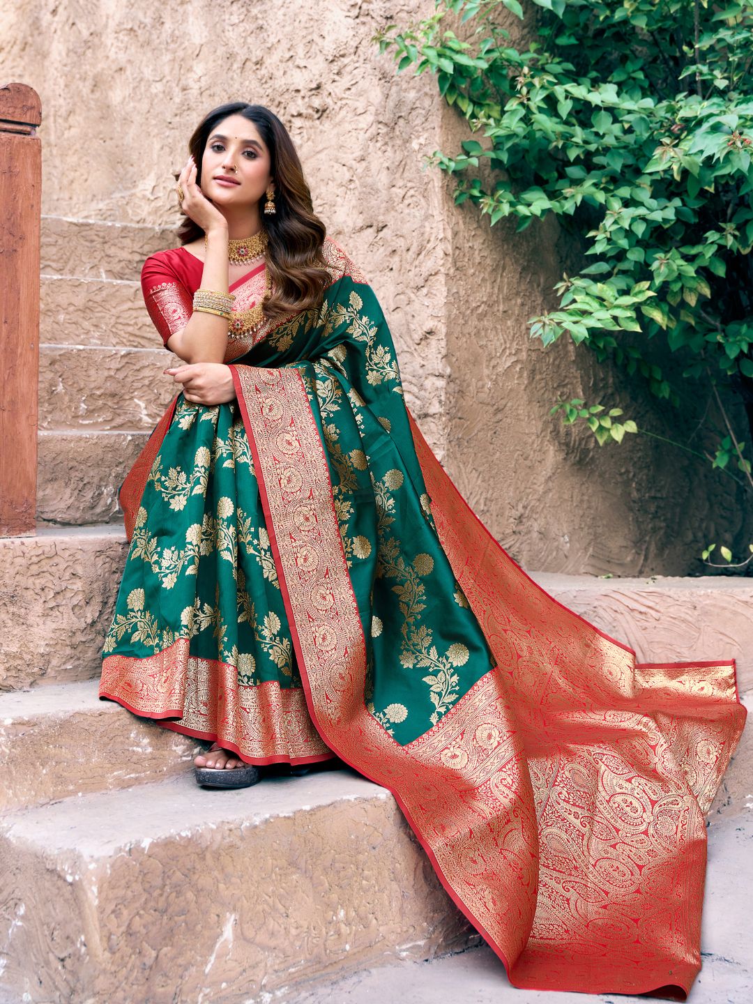 Close upper view of green Banarasi silk saree highlighting Warli weaving work and zari detailing