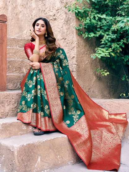 Close upper view of green Banarasi silk saree highlighting Warli weaving work and zari detailing