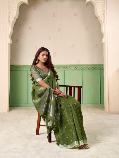 Model posing in green linen silk saree with woven butti design showing full length elegant styling