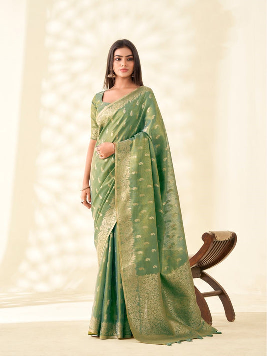 Woman wearing green tissue linen silk saree with zari weaving butti and rich pallu full front view
