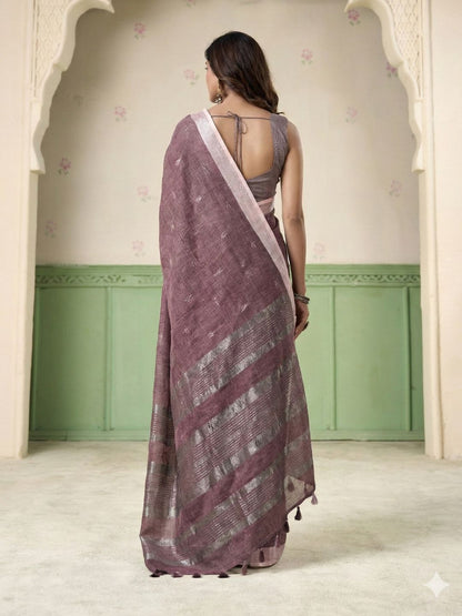 Back view of magenta linen silk saree with thread woven butti design highlighting graceful drape