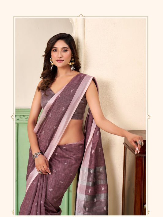 Close view of magenta linen silk saree showcasing thread woven butti design and elegant drape