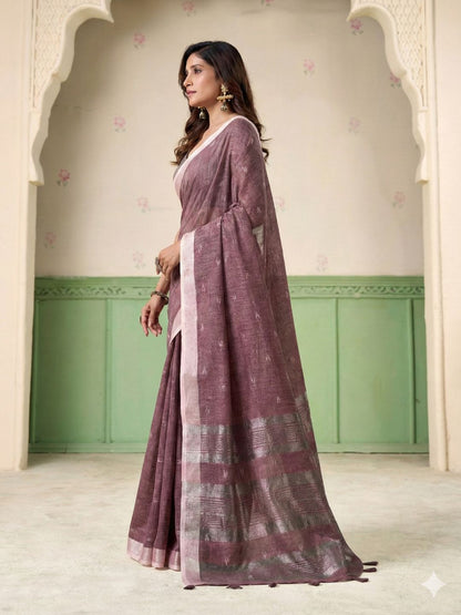 Model posing in magenta linen silk saree with woven butti design showing full length elegant styling