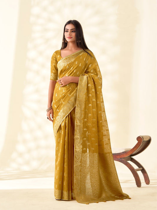 Woman wearing mustard yellow tissue linen silk saree with zari weaving butti and rich pallu full front view