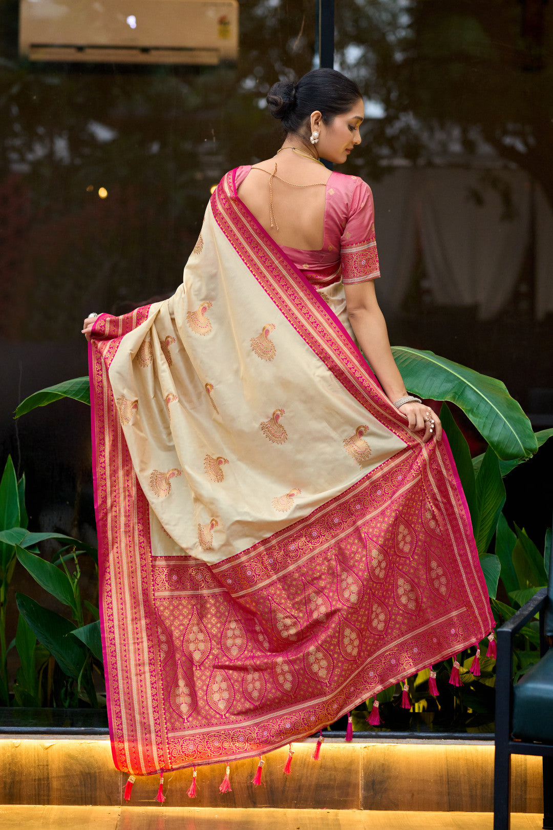 Back view of off white Banarasi silk saree showing zari woven pallu design