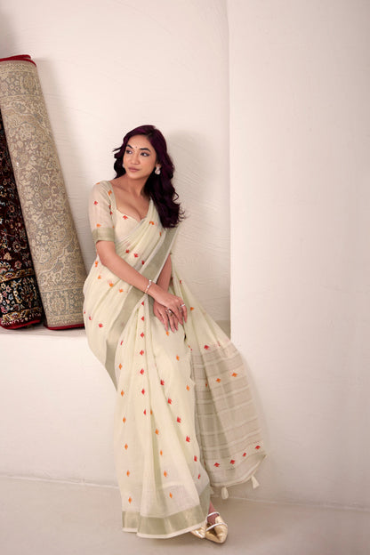 Off white linen silk saree with zari weaving showcasing side pose and graceful drape styling
