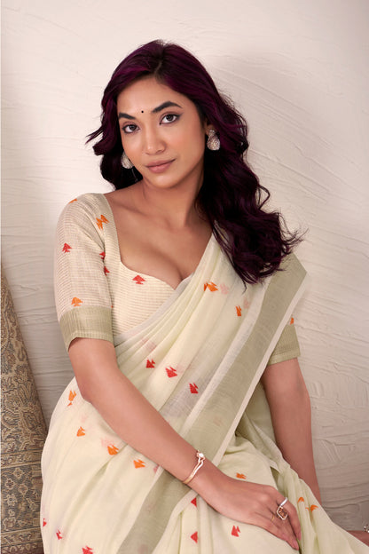 Close-up of off white linen silk saree with zari weaving highlighting fabric texture and design