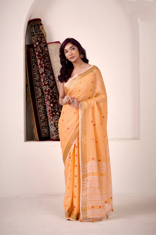 Woman wearing orange soft linen silk saree with zari weaving and elegant lining pallu full view