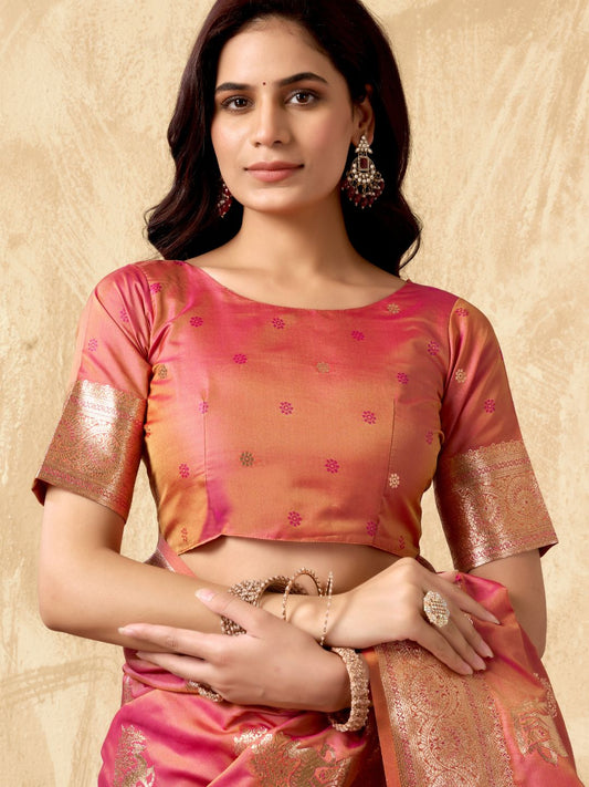 Close view of peach Banarasi silk saree showcasing Warli weaving work and rich zari detailing