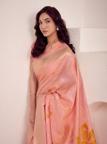 Portrait of model wearing peach linen silk saree with floral pallu highlighting graceful drape
