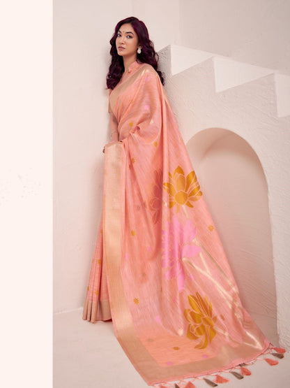 Model posing in peach soft linen silk saree with floral pallu showing full length elegant styling