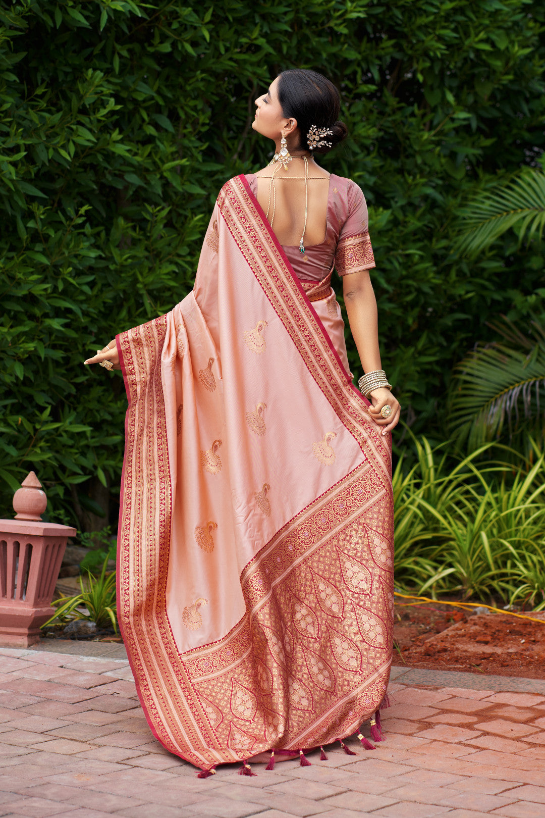 Contrast zari border work on peach Banarasi silk saree