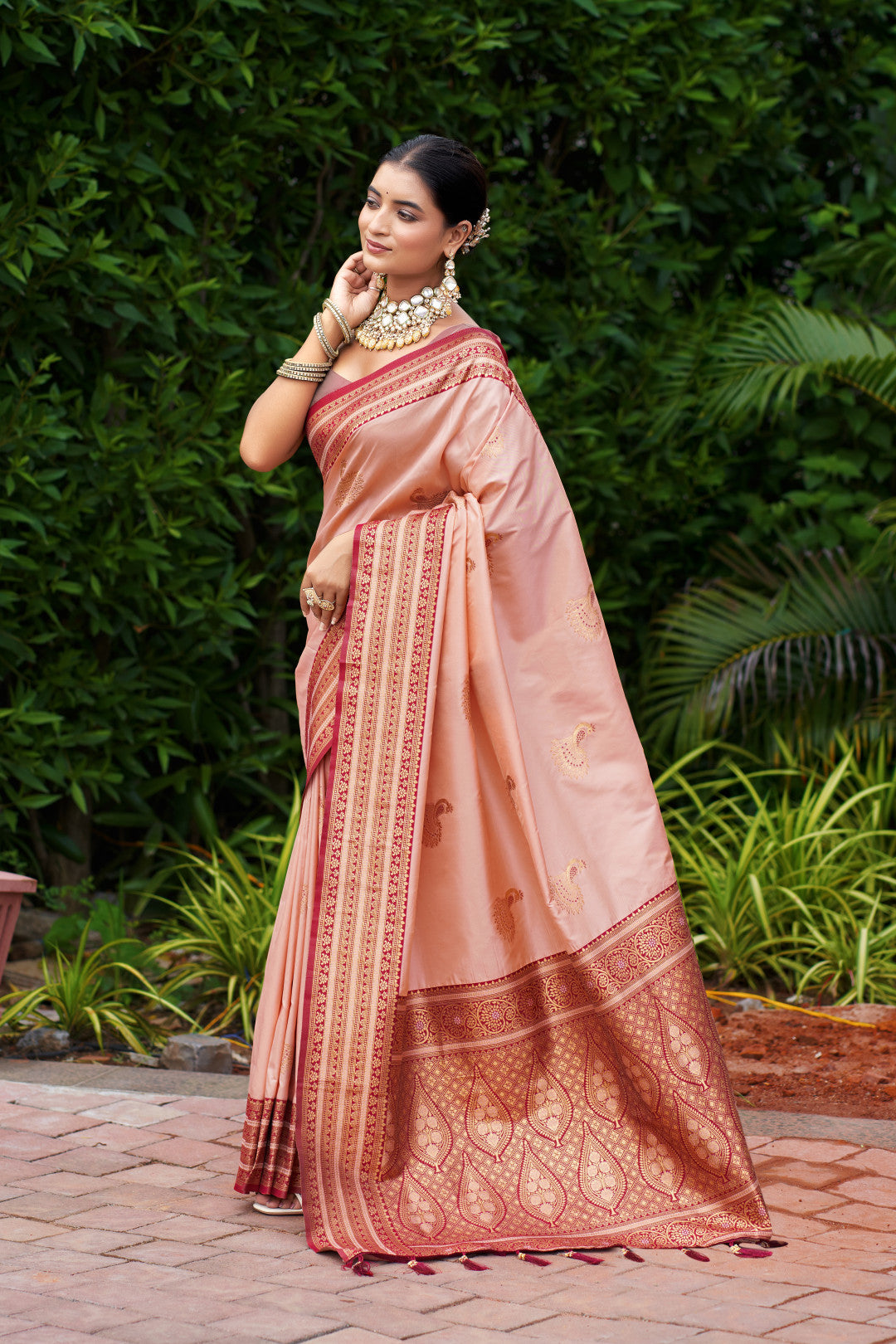 Soft Banarasi silk fabric texture in peach color with zari motifs