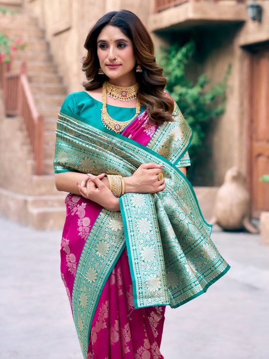 Close upper view of pink Banarasi silk saree showcasing Warli weaving work and rich zari detailing