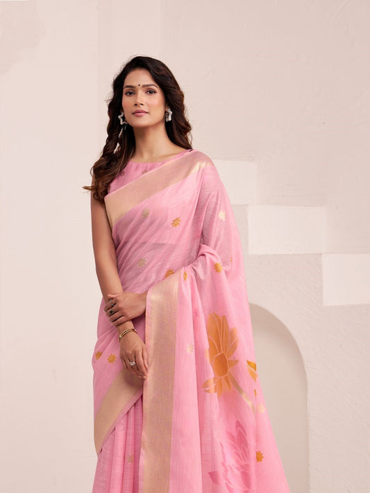 Close view of pink linen silk saree showcasing floral pallu design and soft fabric texture