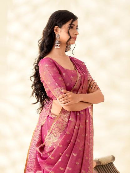Side portrait of pink tissue linen silk saree with zari butti highlighting graceful drape