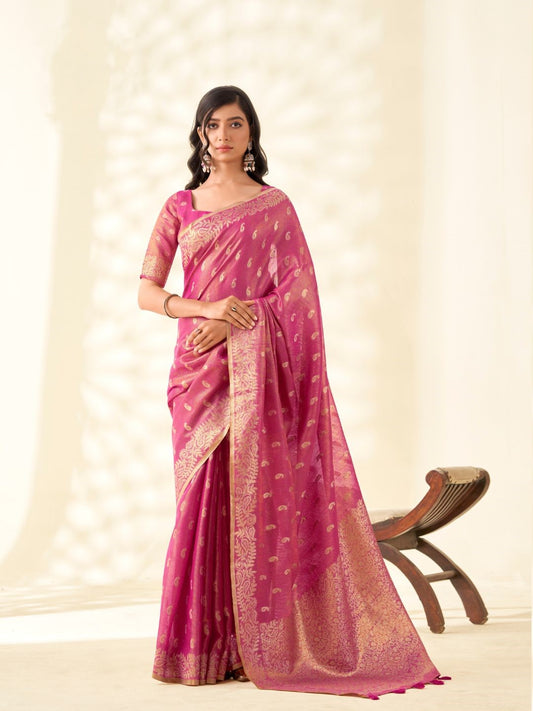 Woman wearing pink tissue linen silk saree with zari weaving butti and rich pallu full front view