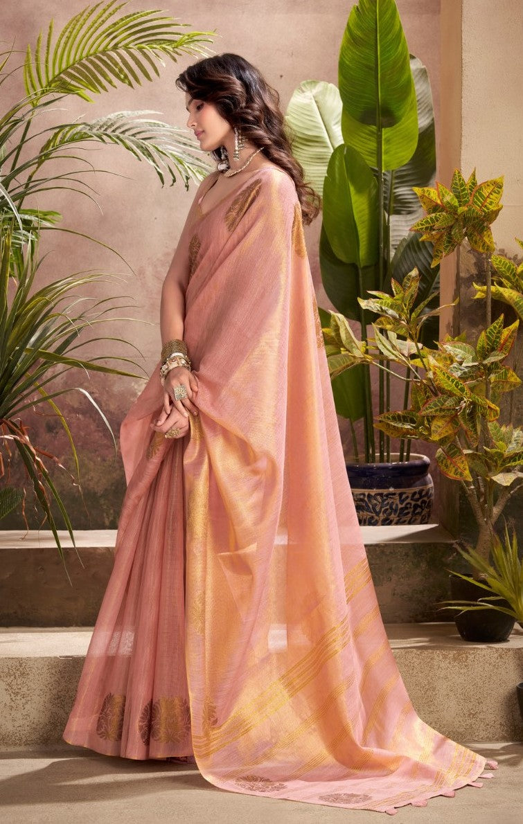 Model posing in pink tissue silk saree with zari butta and border pallu showing full length party wear styling