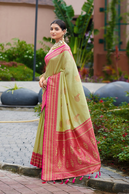Model wearing pista green Banarasi silk saree with zari weaving in full length side standing view
