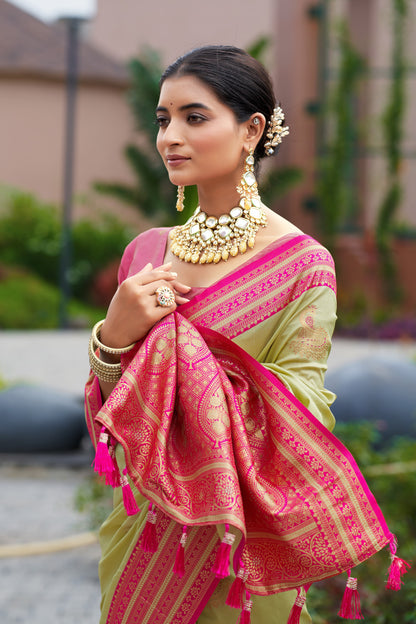 Pista green Banarasi silk saree with zari woven pallu and contrast border drape