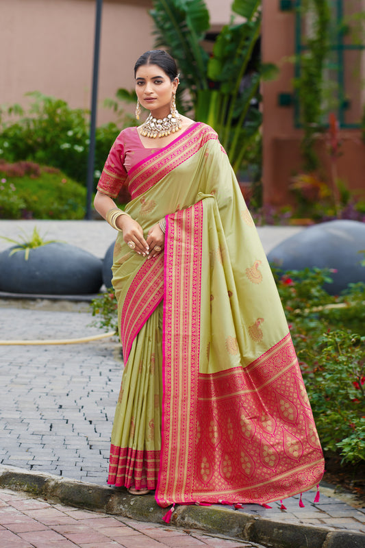 Pista green soft Banarasi silk saree with zari weaving work and contrast border by JaipurSaaj