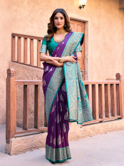 Model posing in purple Banarasi silk saree with Warli work showing full length wedding and festive styling