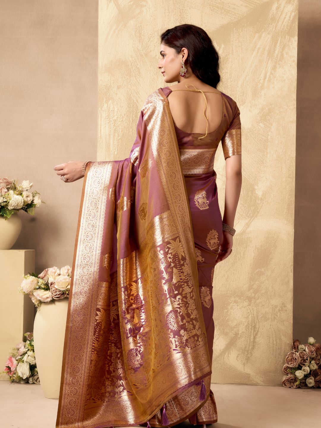 Back view of purple Banarasi silk saree showcasing rich zari pallu and Warli weaving design