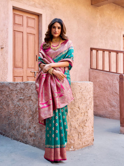 Model posing in rama green Banarasi silk saree with Warli work showing full length wedding and festive styling
