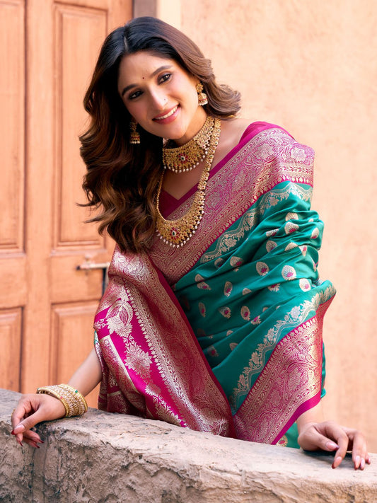 Close upper view of rama green Banarasi silk saree showcasing Warli weaving work and rich zari detailing