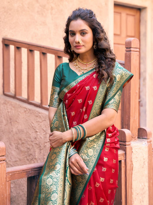 Close upper view of red Banarasi silk saree showcasing Warli weaving work and rich zari detailing