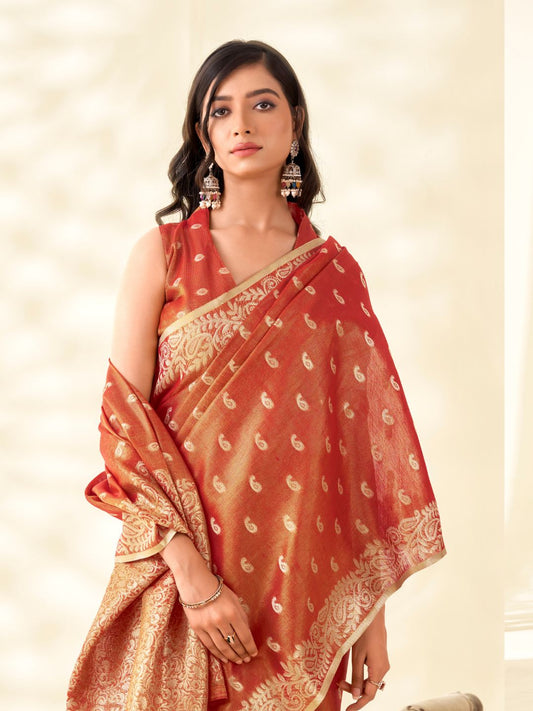 Close view of red tissue linen silk saree showcasing zari weaving butti and elegant pallu detailing