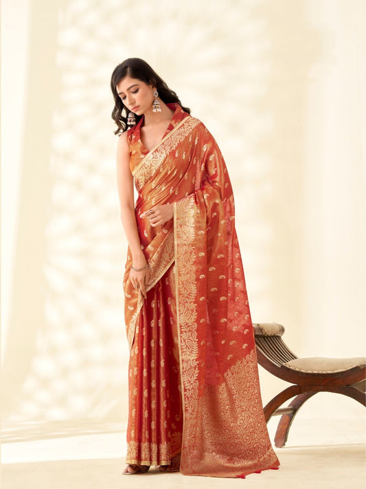 Woman wearing red tissue linen silk saree with zari weaving butti and rich pallu full front view