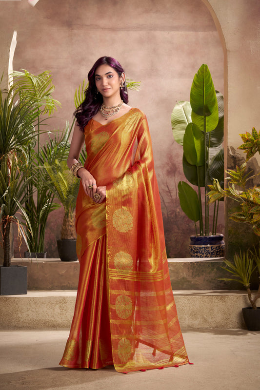 Woman wearing red tissue silk saree with zari weaving butta and zari border pallu full front view