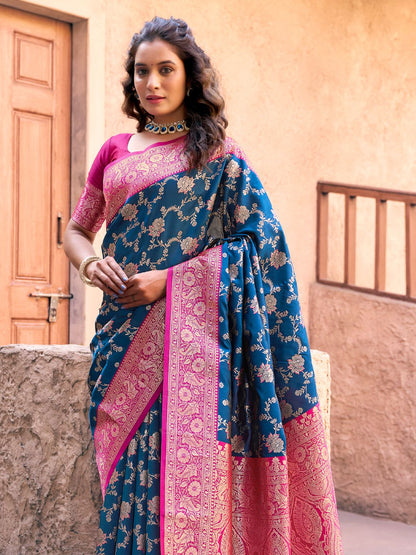Side view of royal blue Banarasi silk saree with Warli weaving work showcasing graceful drape