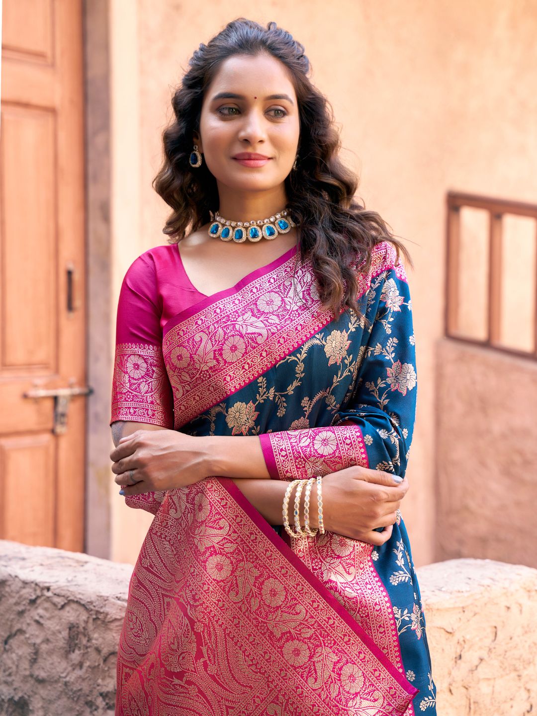 Close upper view of royal blue Banarasi silk saree showcasing Warli weaving work and rich zari detailing
