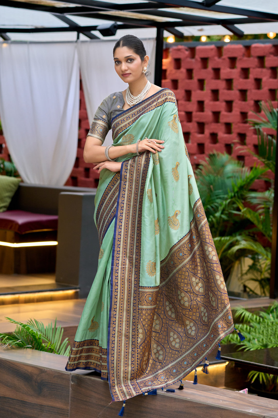 Full length view of sea green Banarasi silk saree with zari weaving work
