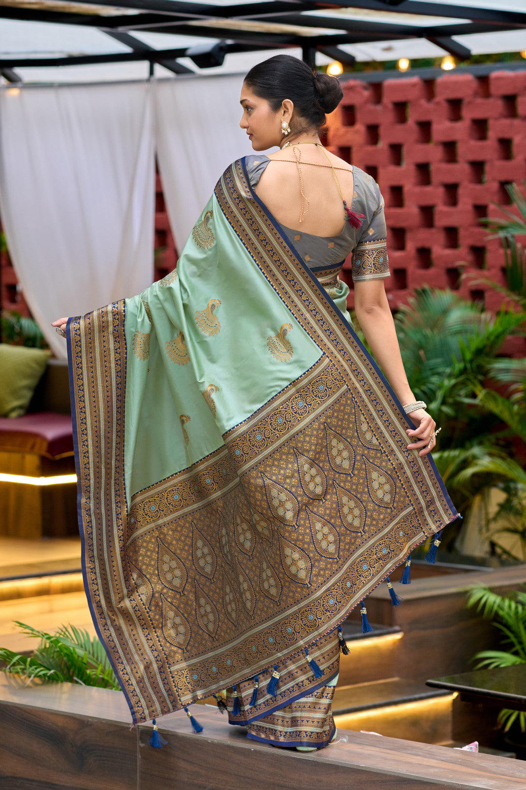 Back view of sea green Banarasi silk saree showing zari woven pallu design