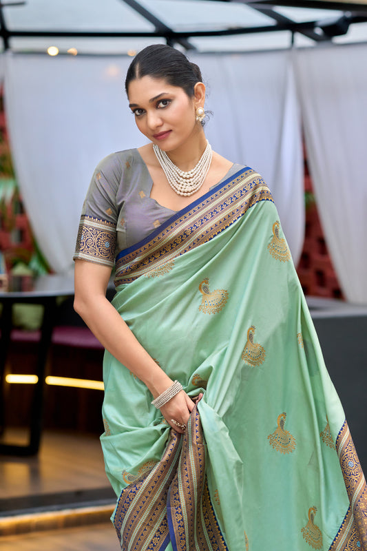 Sea green Banarasi silk saree with zari weaving and contrast border side drape look