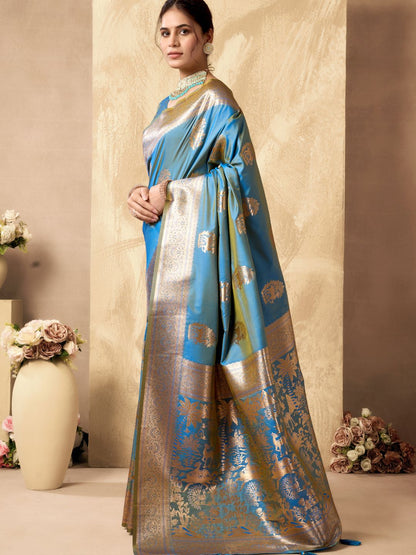Side view of sky blue Banarasi silk saree with Warli weaving work showcasing graceful drape