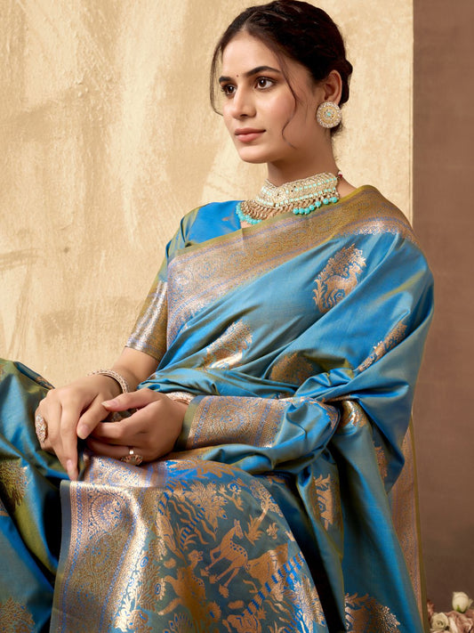 Close upper view of sky blue Banarasi silk saree showcasing Warli weaving work and zari detailing