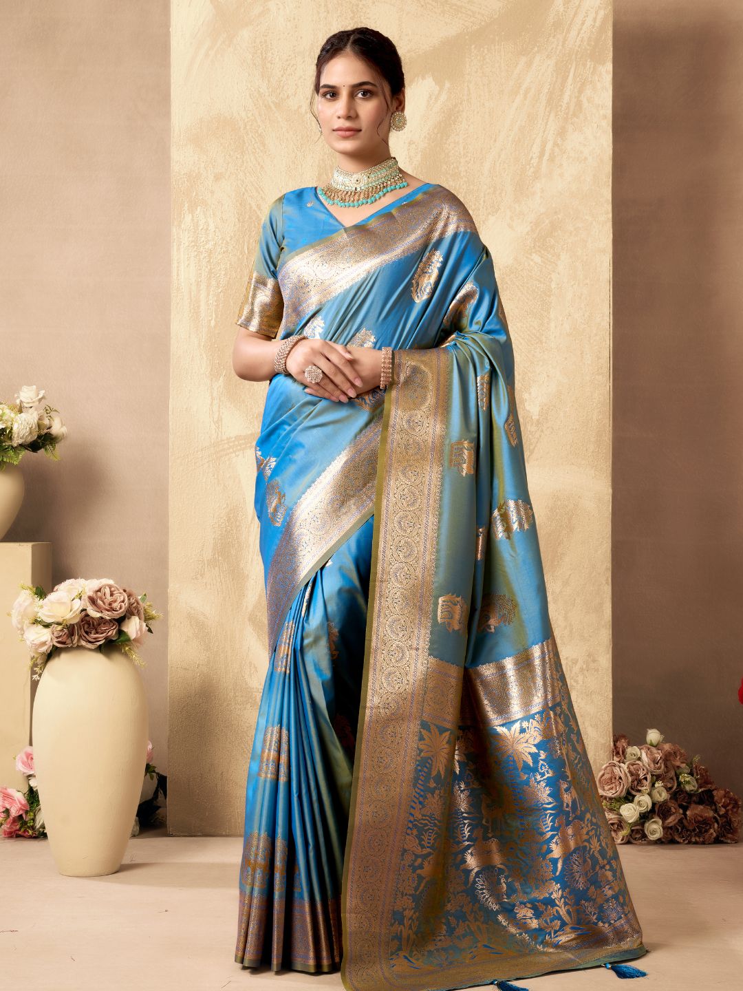 Woman wearing sky blue Banarasi silk saree with Warli weaving work and zhallar border full front view